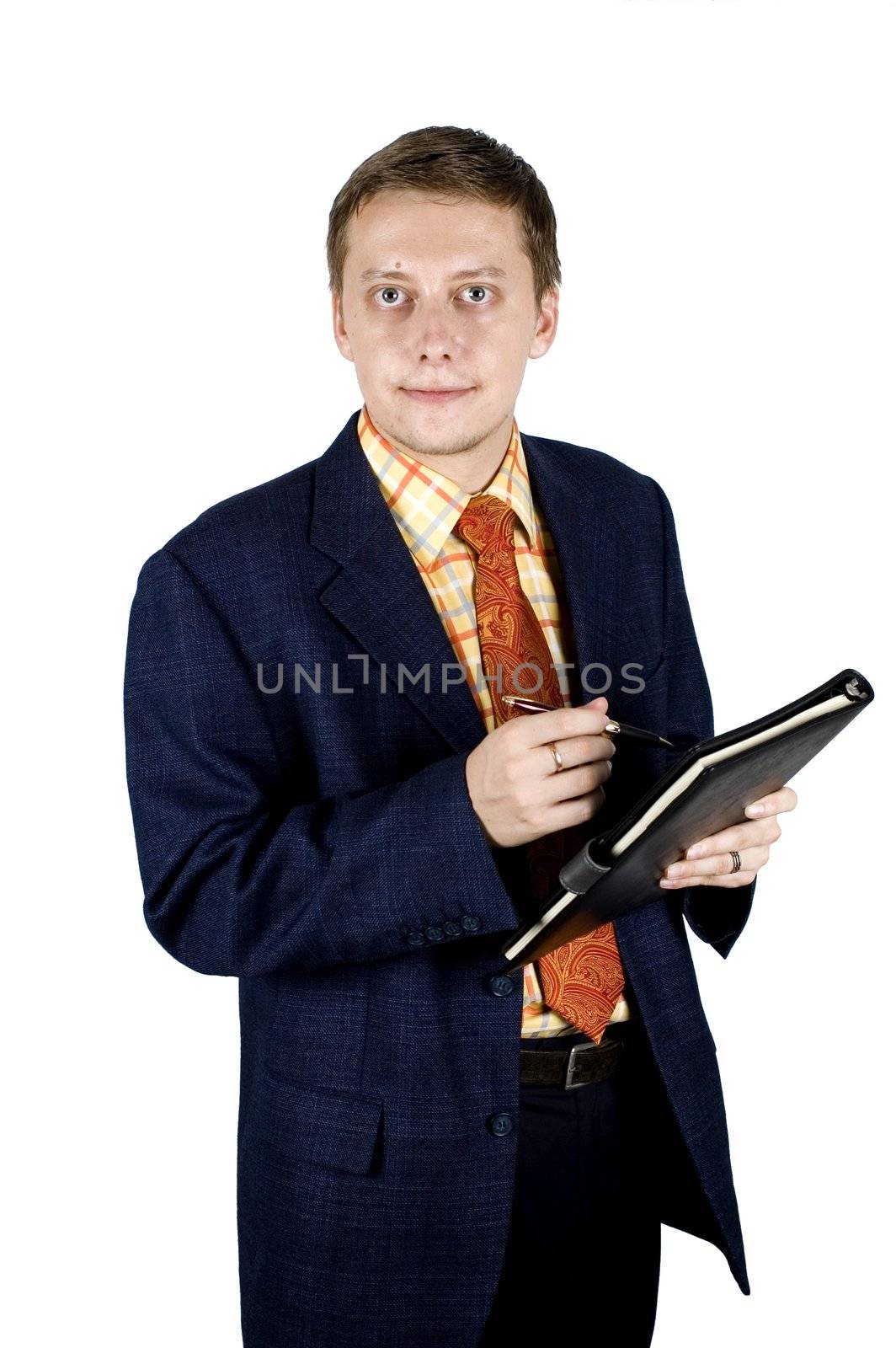 Young, successful and happy businessman holding pen and notebook.