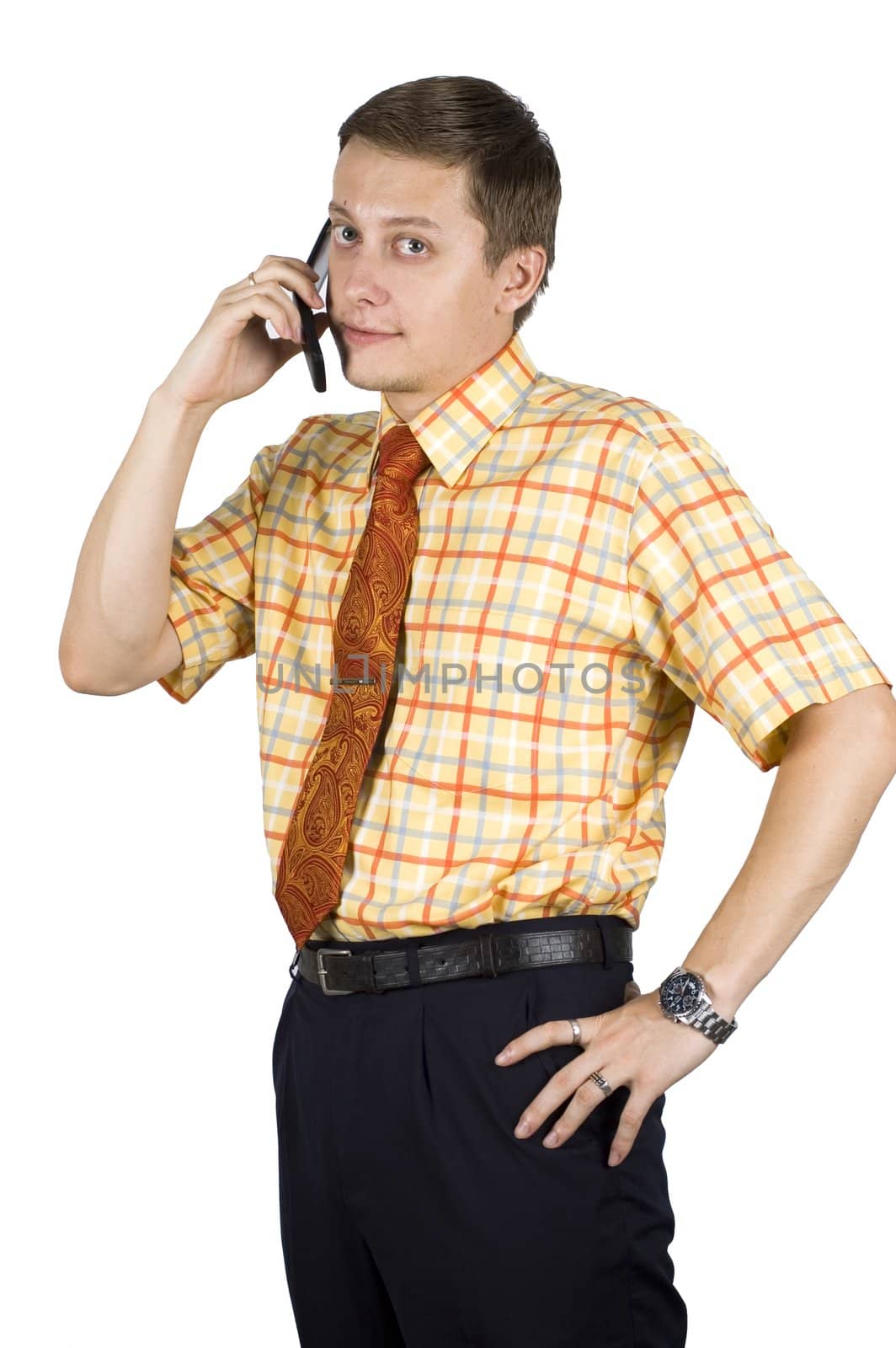 Young, elegant European businessman, wearing suit, shirt and tie. Smiling friendly. Talking on mobile phone