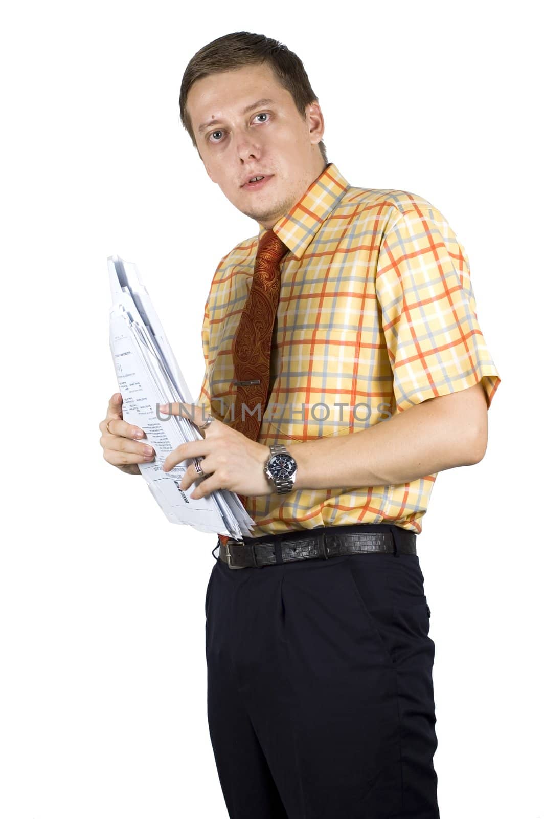 Young, elegant European businessman, wearing suit, shirt and tie. Smiling friendly. Holding documents