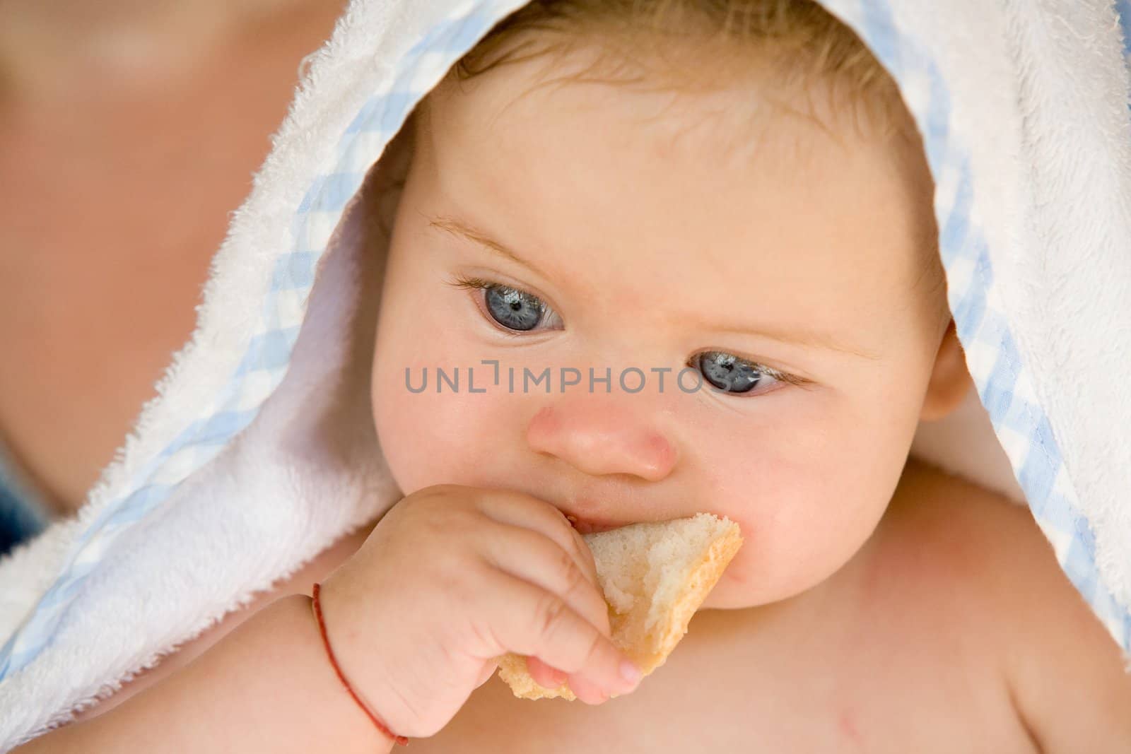 people series: portrait of adorable baby with bread