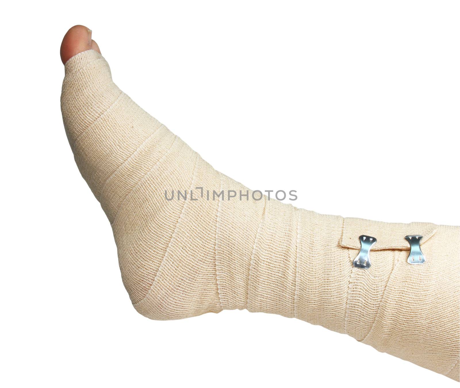 right foot and ankle wrapped in an ace bandage isolated with clipping path at this size