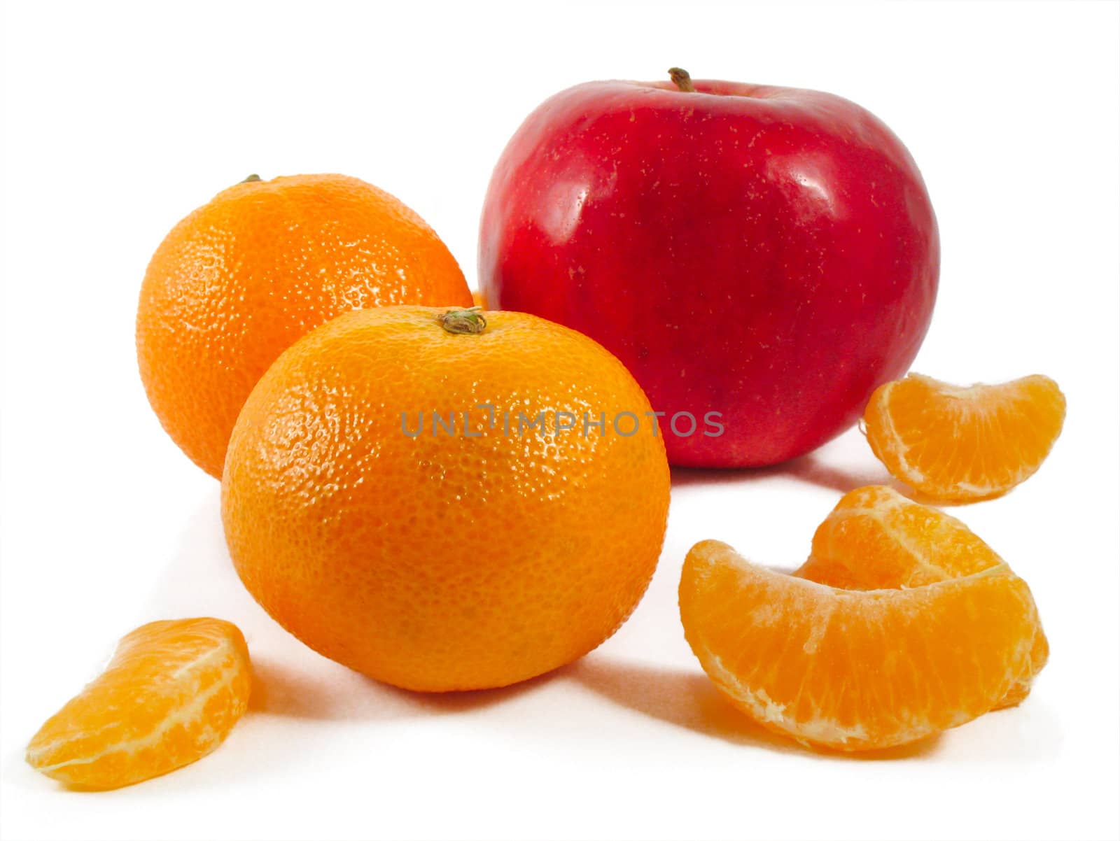 mandarines and red apple on a white background