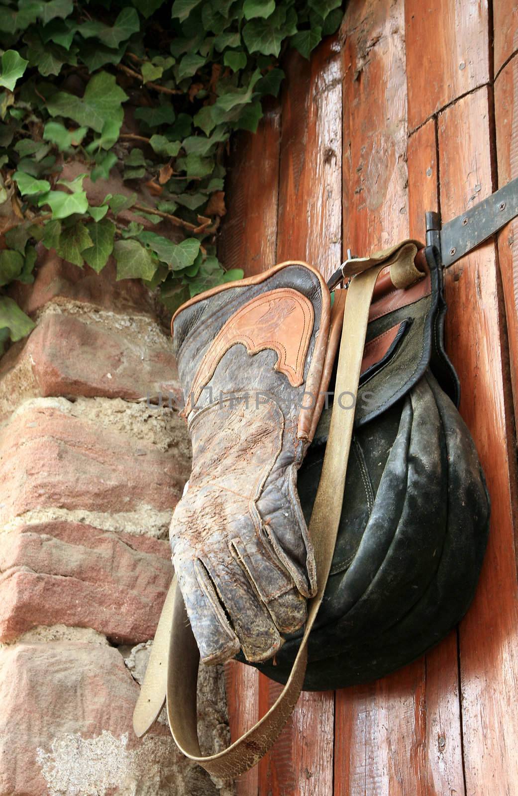 Equipment  the falconer - the leather bag and the glove - hanging on the gate in the Château de Kintzheim  (The Eagles' Nest’ )