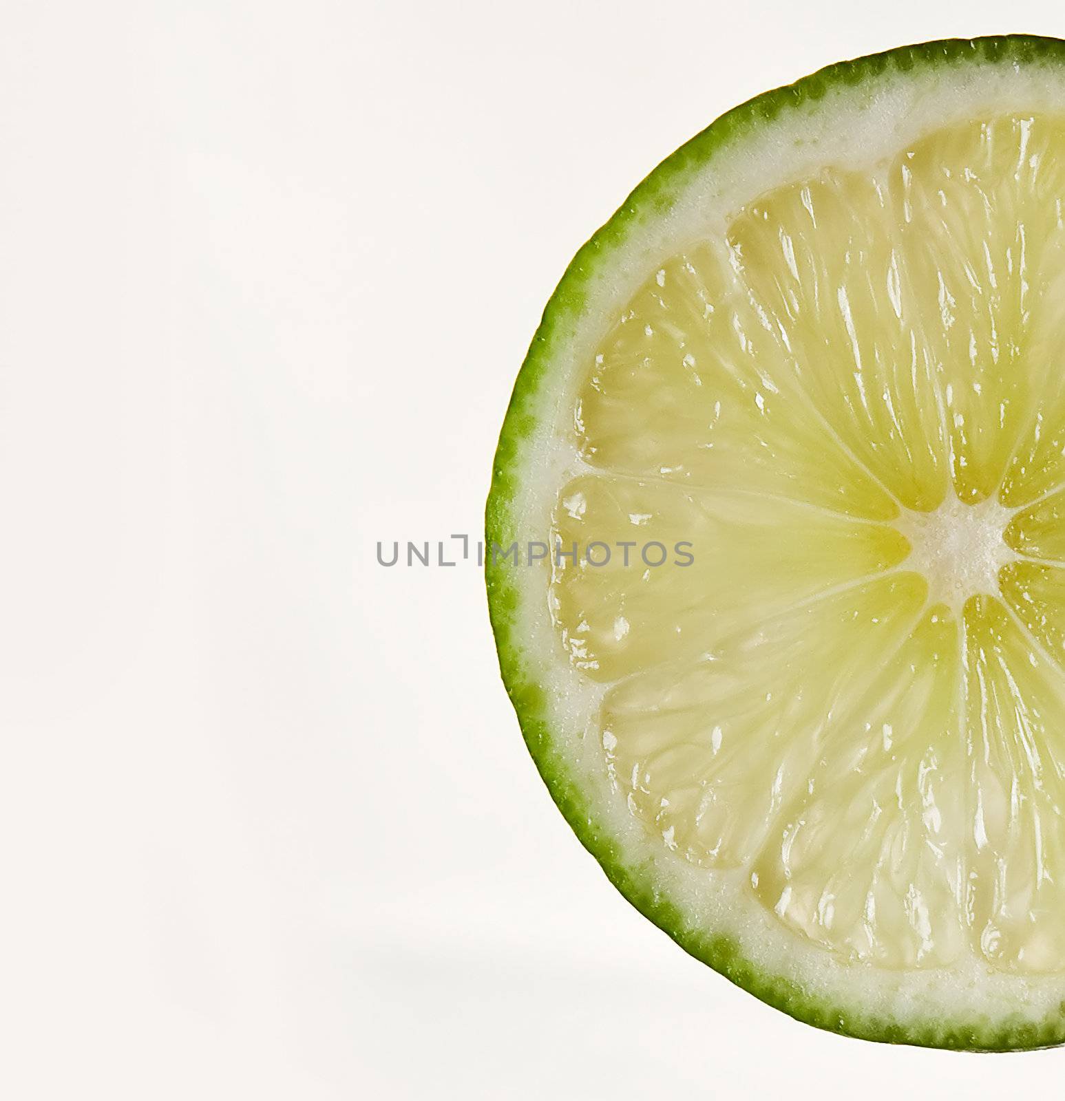 A wedge of lime, isolated on white