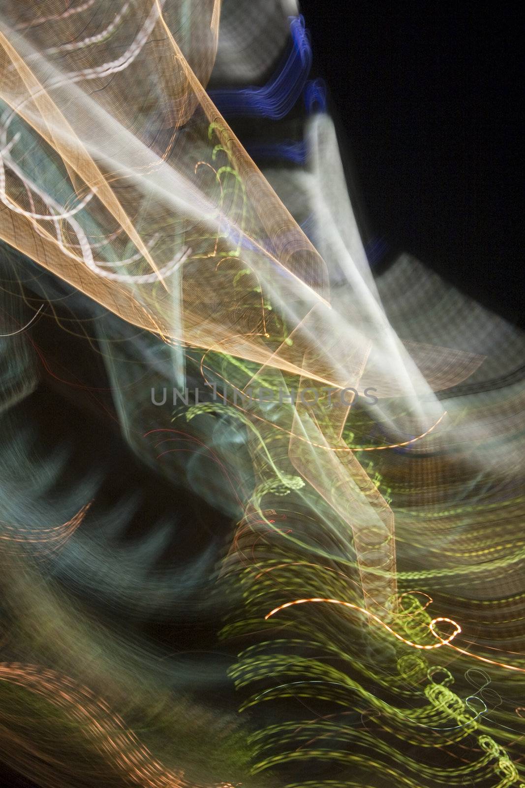 Abstract light trails captured from cars, signs, and other landmarks