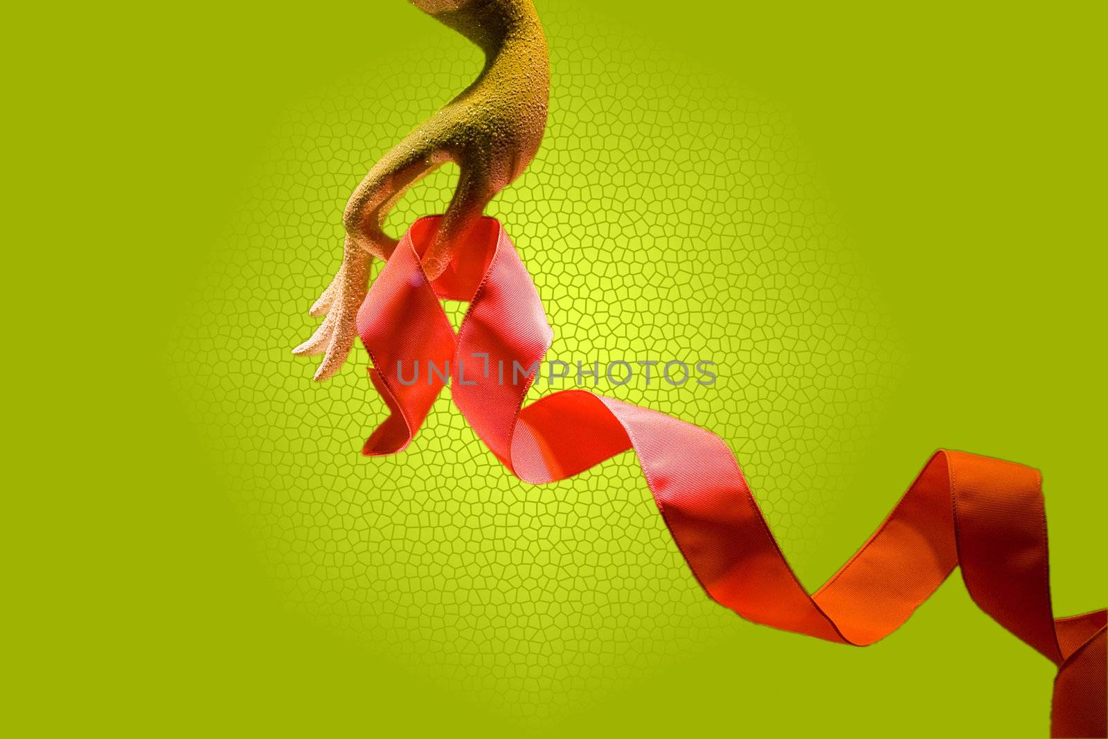 Hand with a red/orange ribbon, isolated on a green background