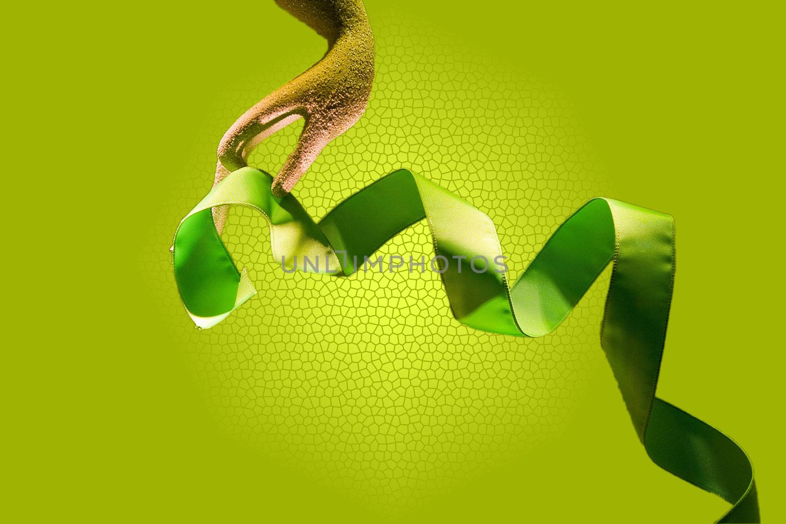 Hand with green ribbon; isolated on a green background