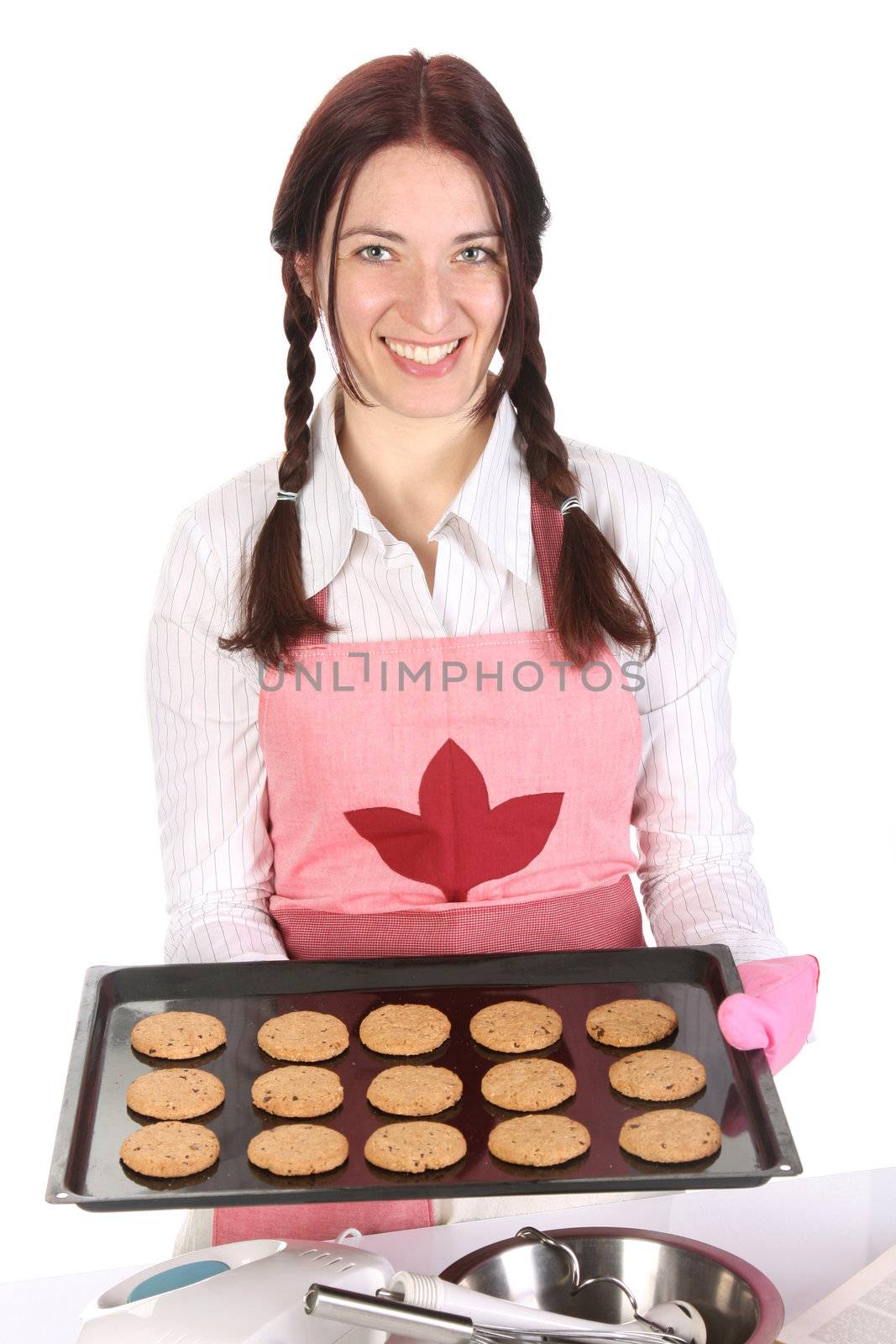 beautiful housewife showing off cakes on white background