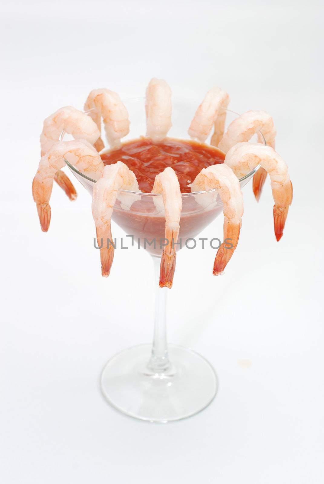 Shrimp cocktail in martini glass.