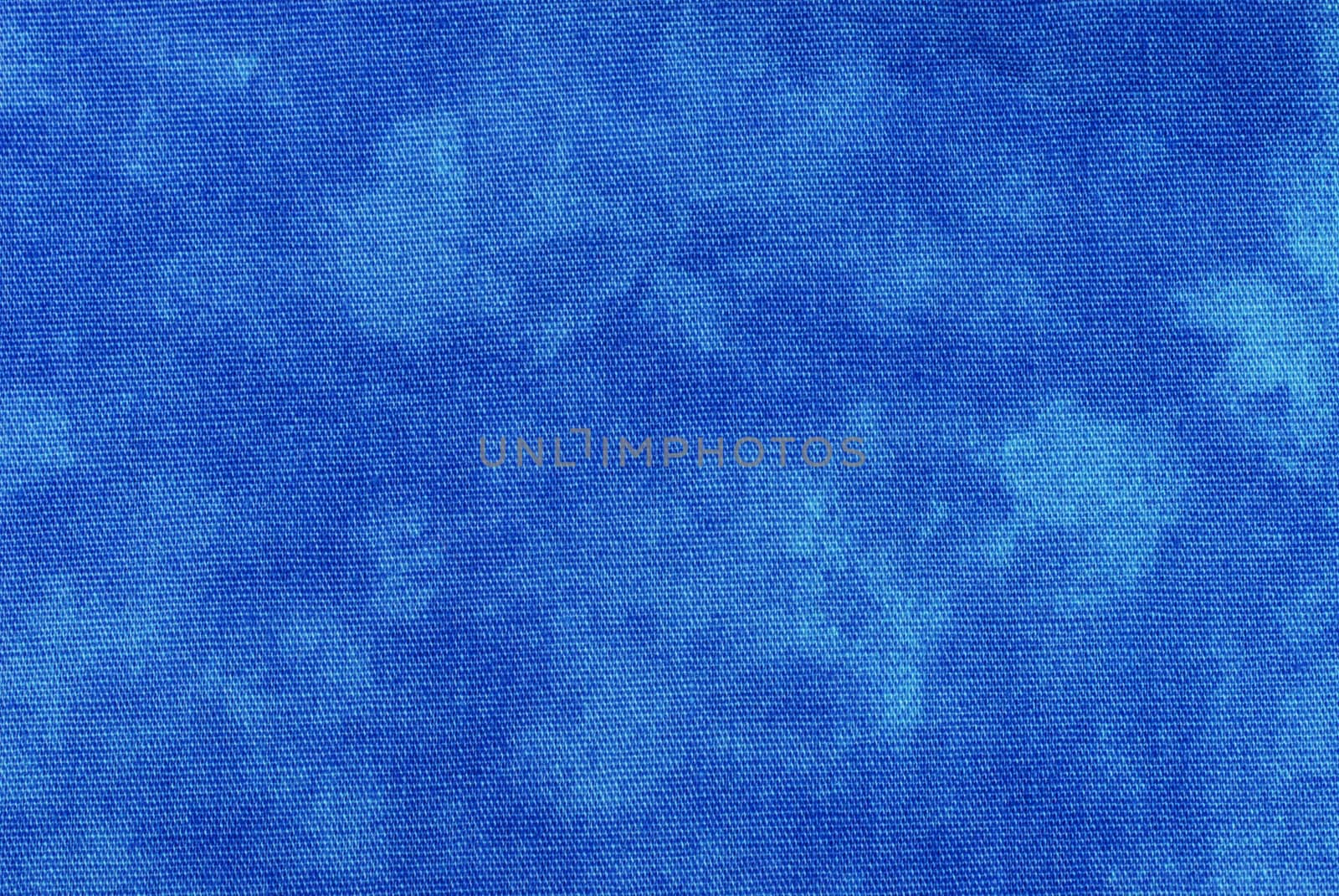 Macro of blue tye-dyed fabric for background use. 