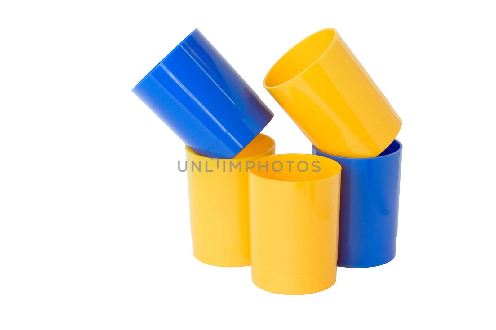 Five colored plastic cups, isolated on a white background.