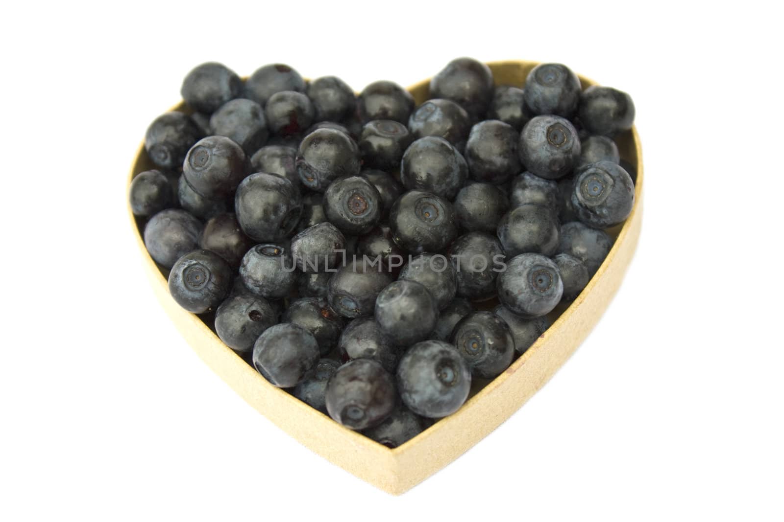 Bilberries (eruopean blueberries) in heart shaped box, isolated on white background