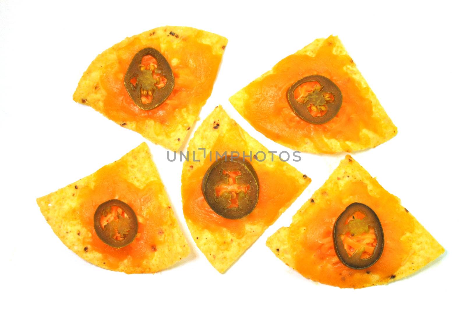 Five nachos isolated on white background.