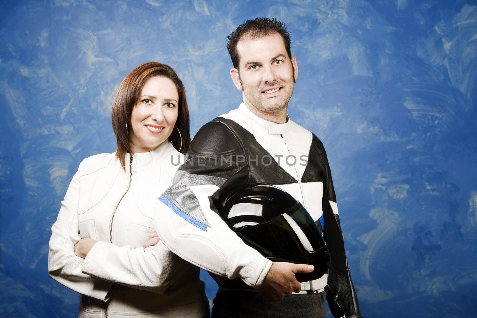 Attractive couple wearing high-end motorcycle gear