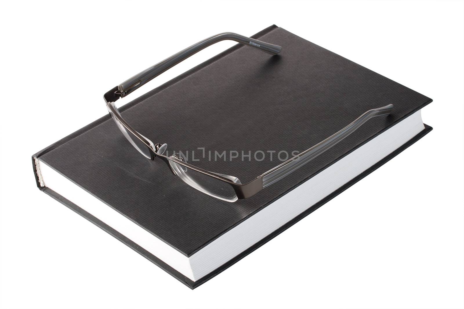 glasses on a book by Alekcey