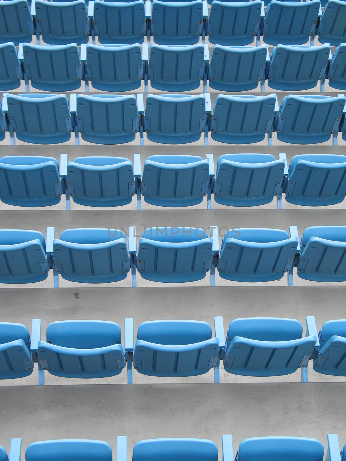 blue aligned plastic chairs by mmm