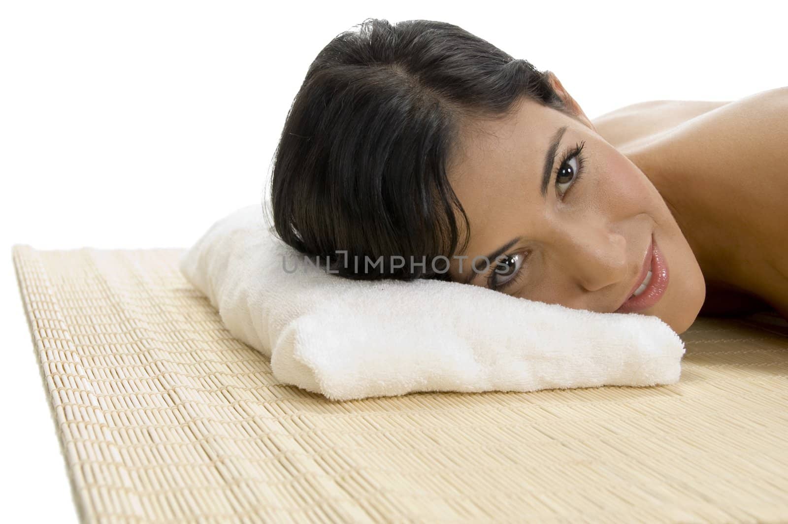 laying woman looking to camera on an isolated background