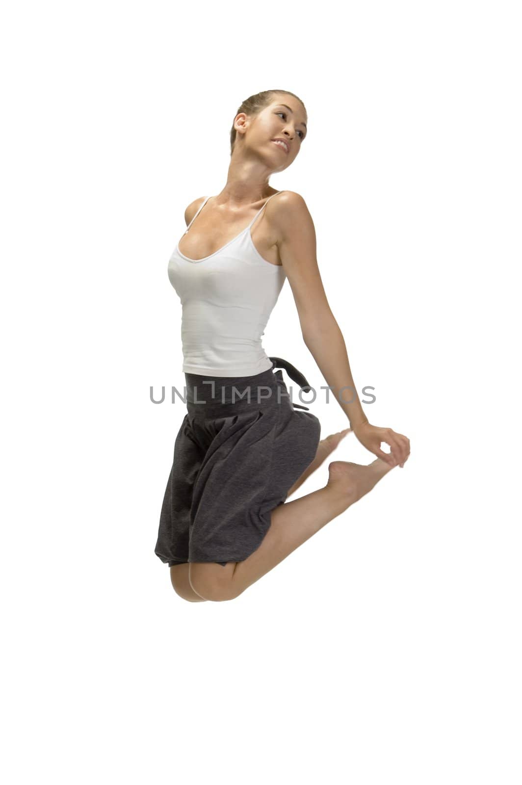 jumping woman holding her legs