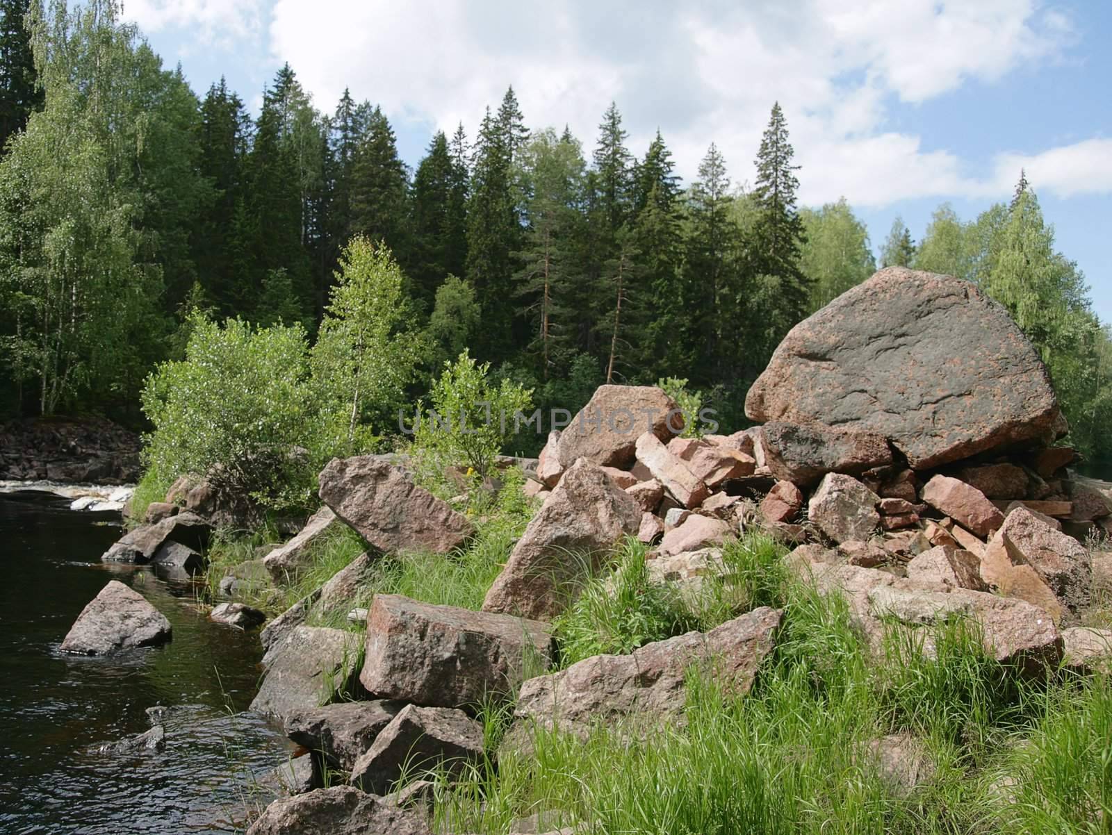 Boulders on a river bank in Karelia, Russia