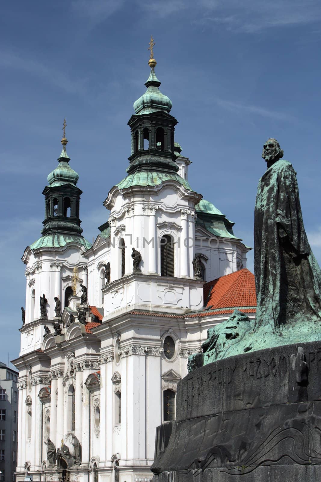 Statue in a Square overshawing a prominent building