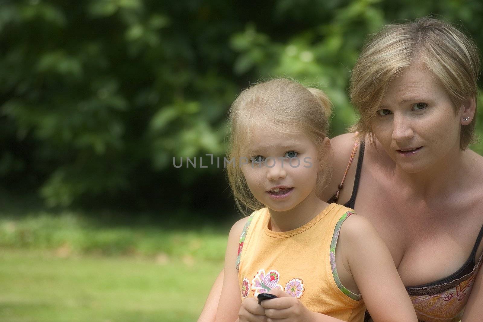 Portrait of girls in the open air on the blur background 