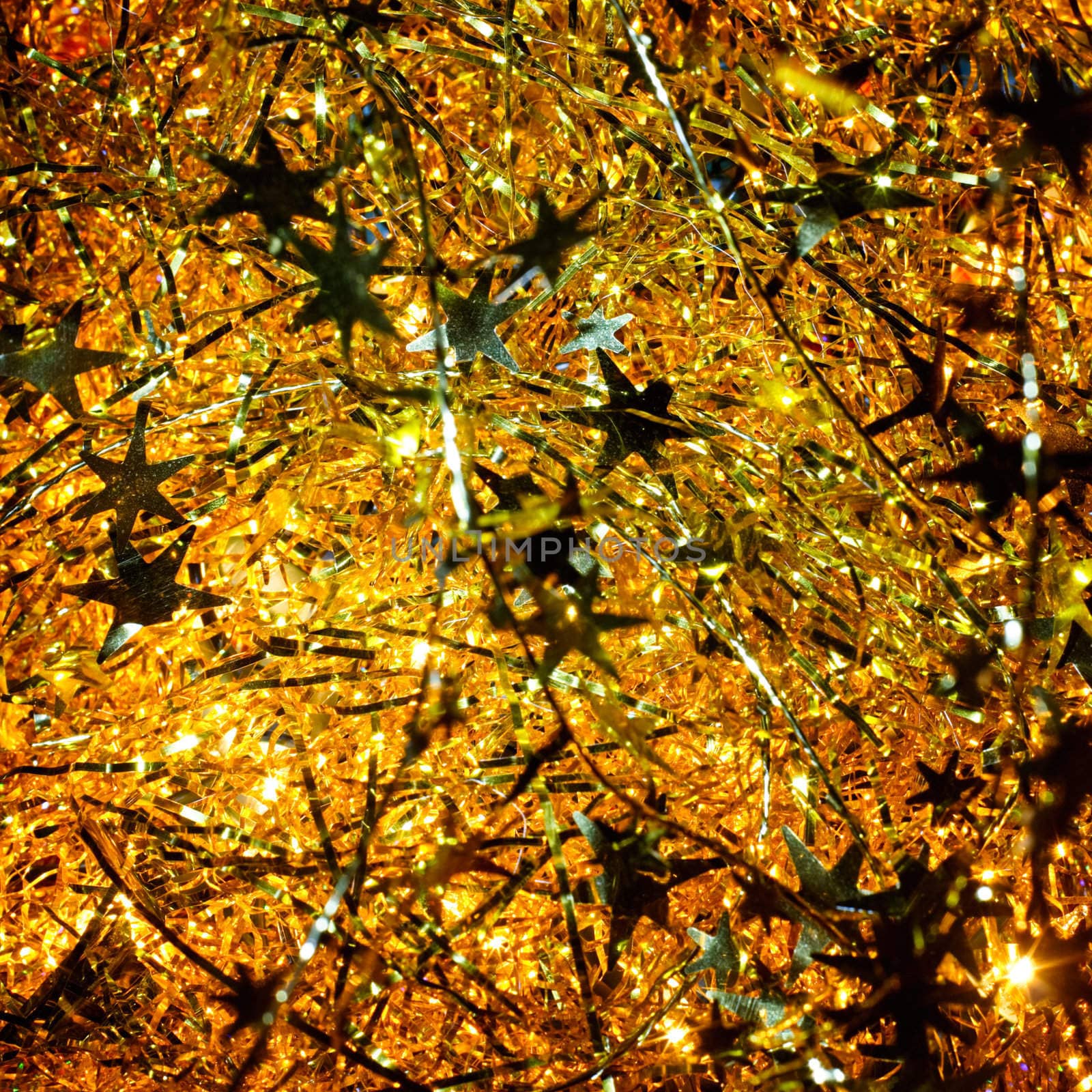 Illuminated golden Christmas tinsel background