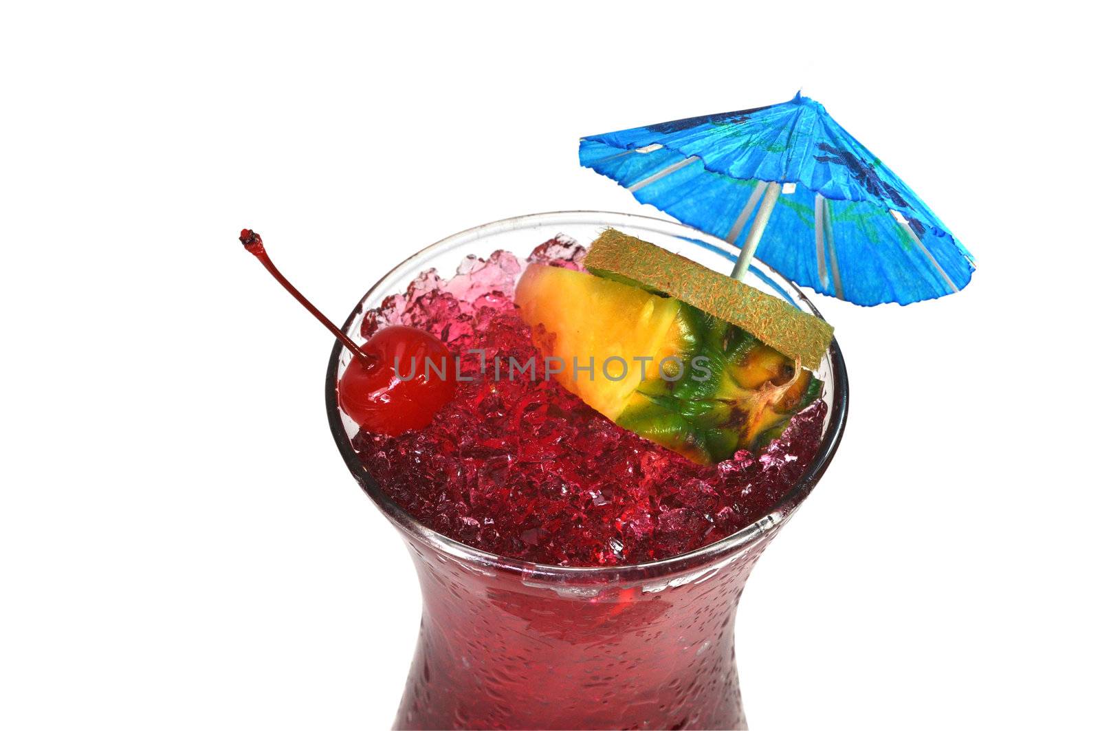 Hurricane tropical drink with pineapple, kiwi, cherry, and umbrella.  Isolated on white background with clipping path.