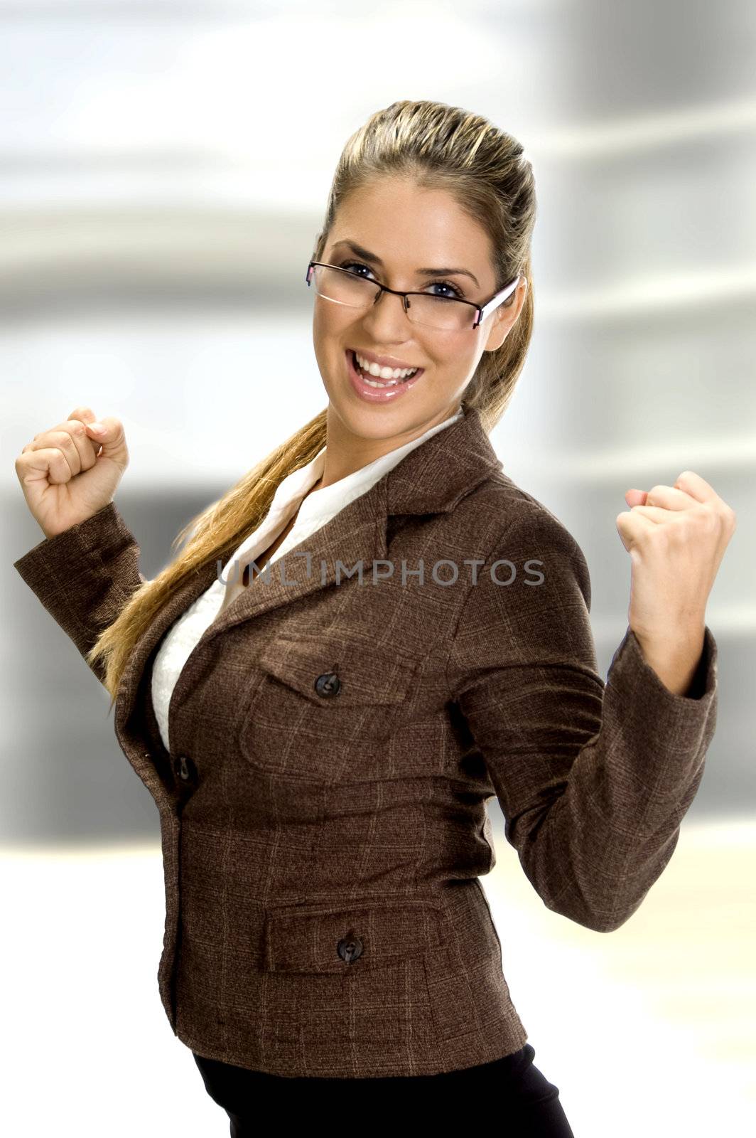 woman smiling and enjoying in happiness of success on an abstract background