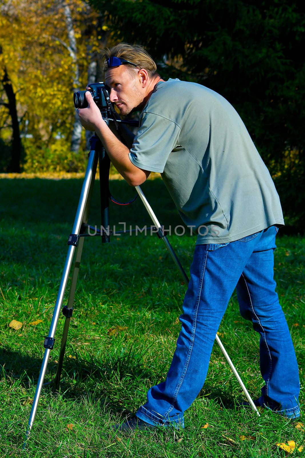 The photographer photographing the nature. Autumn, outdoor