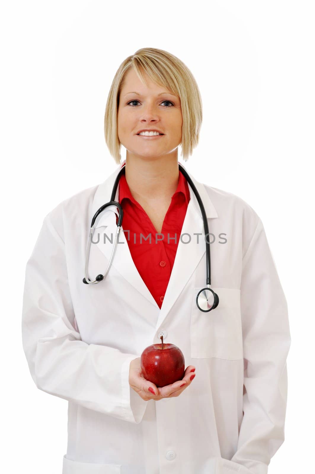 Female doctor with apple and stethoscope isolated on white background.