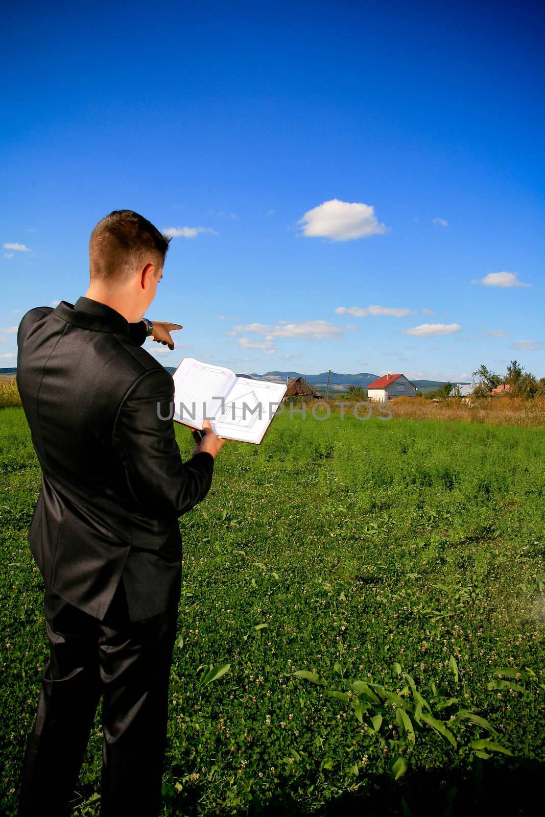 Real estate agent locating a piece of land