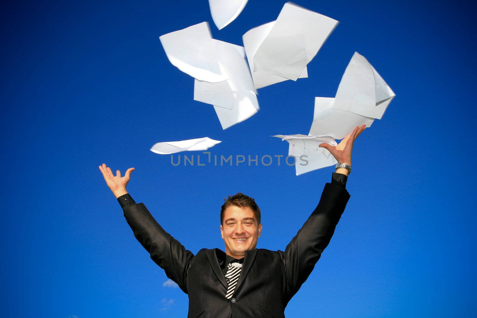 Young man throws away his documents.