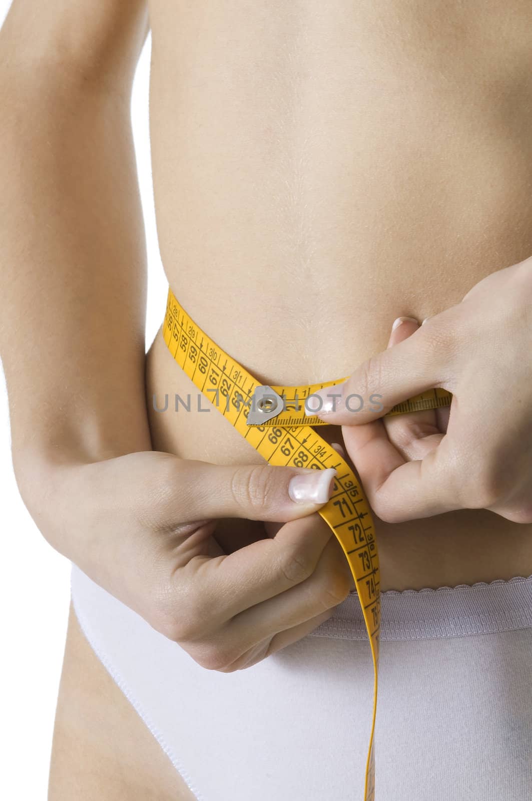 close up of a female body measuring her waist