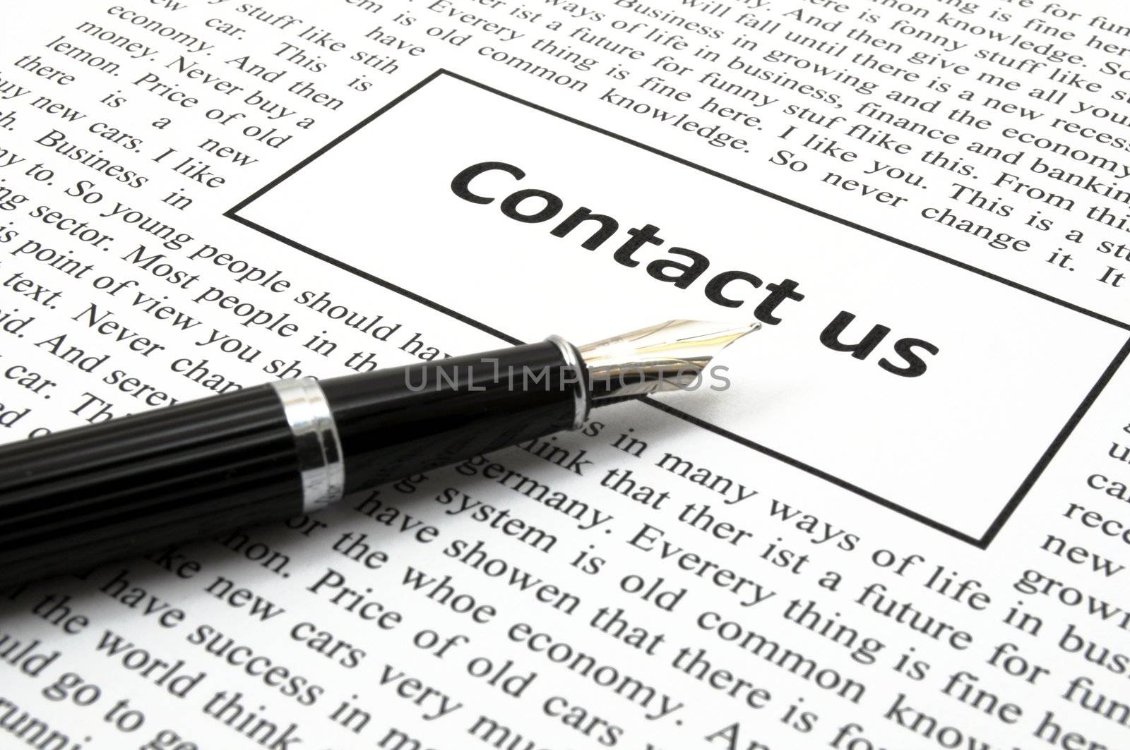 contact us concept with newspaper showing business communication