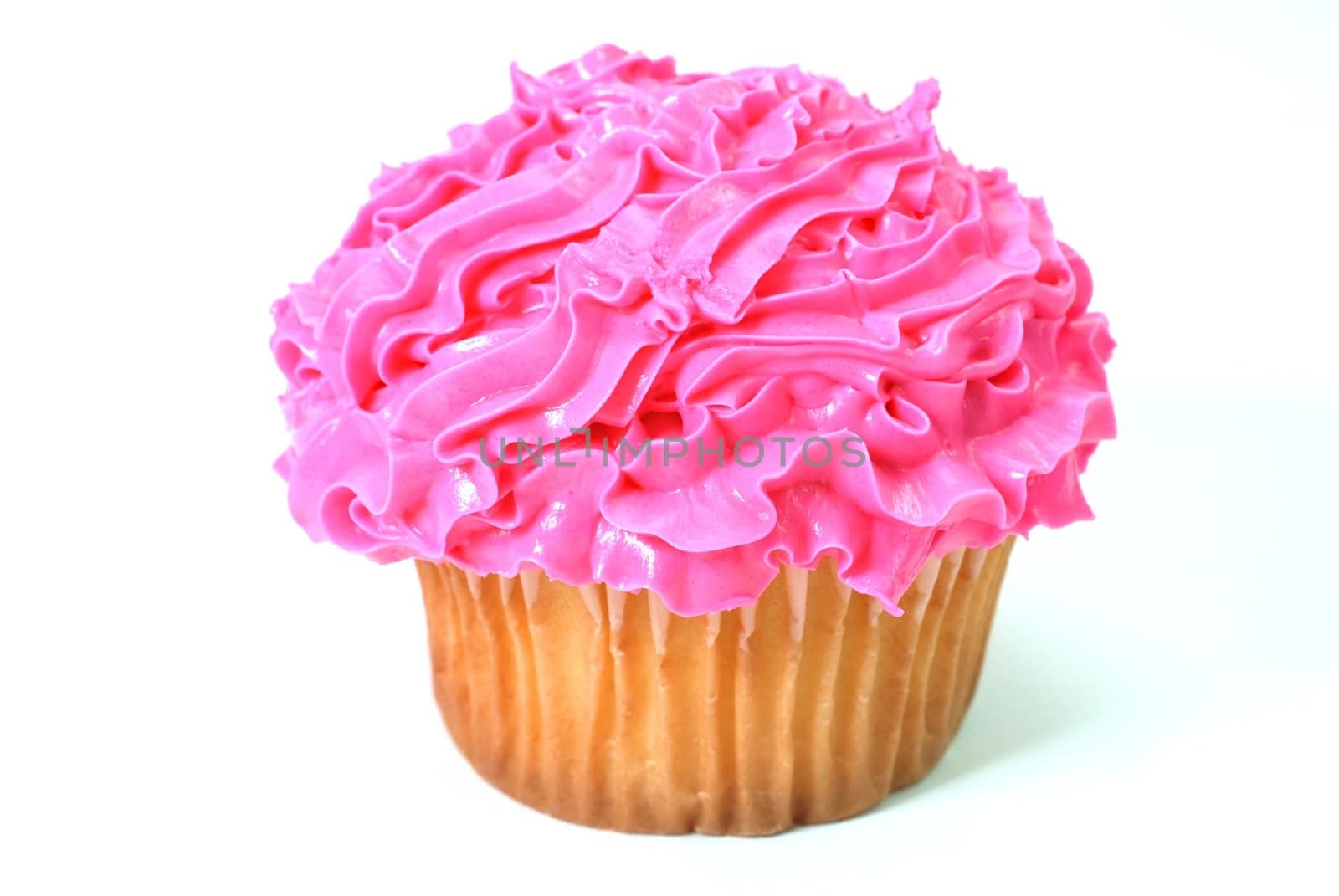 Cupcake with pink decorative frosting.  Isolated on white background.