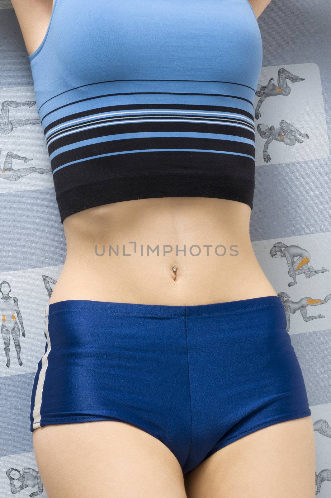 close up on a stomach of a girl wearing blue fitness dress