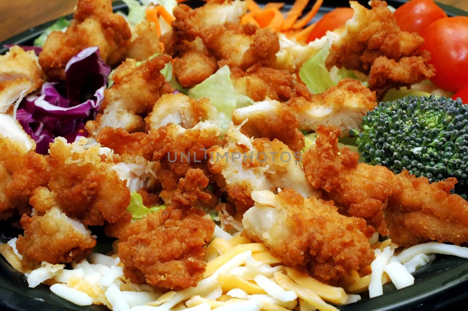 Salad with chopped chicken.