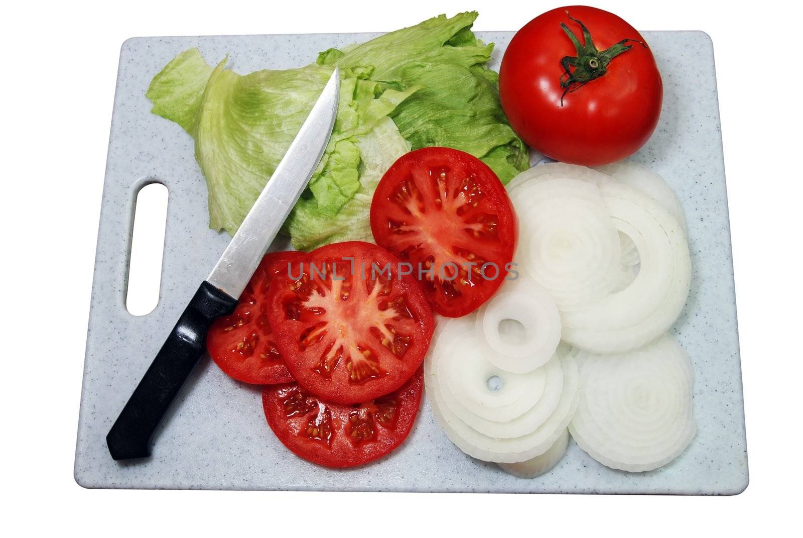 Tomato, lettuce, onions and knife on cutting board.  Isolated on white background with clipping path.