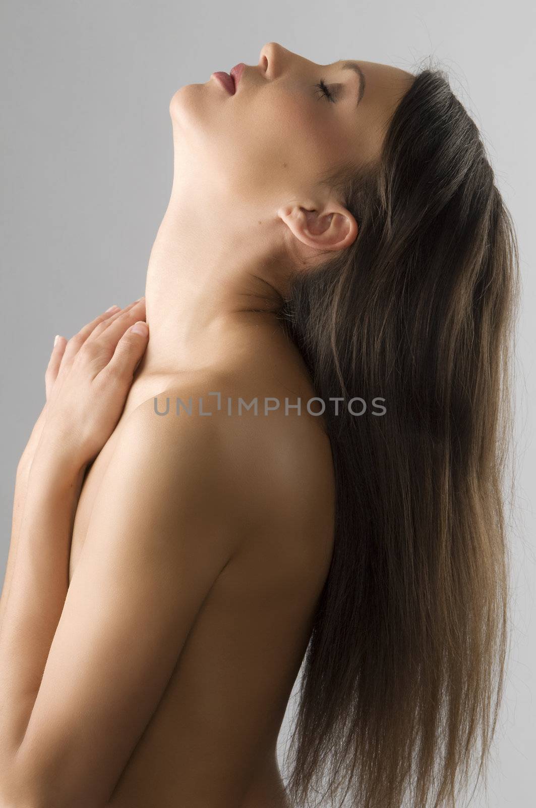 freedom shot of beautiful girl with her head up and long hair falling down free