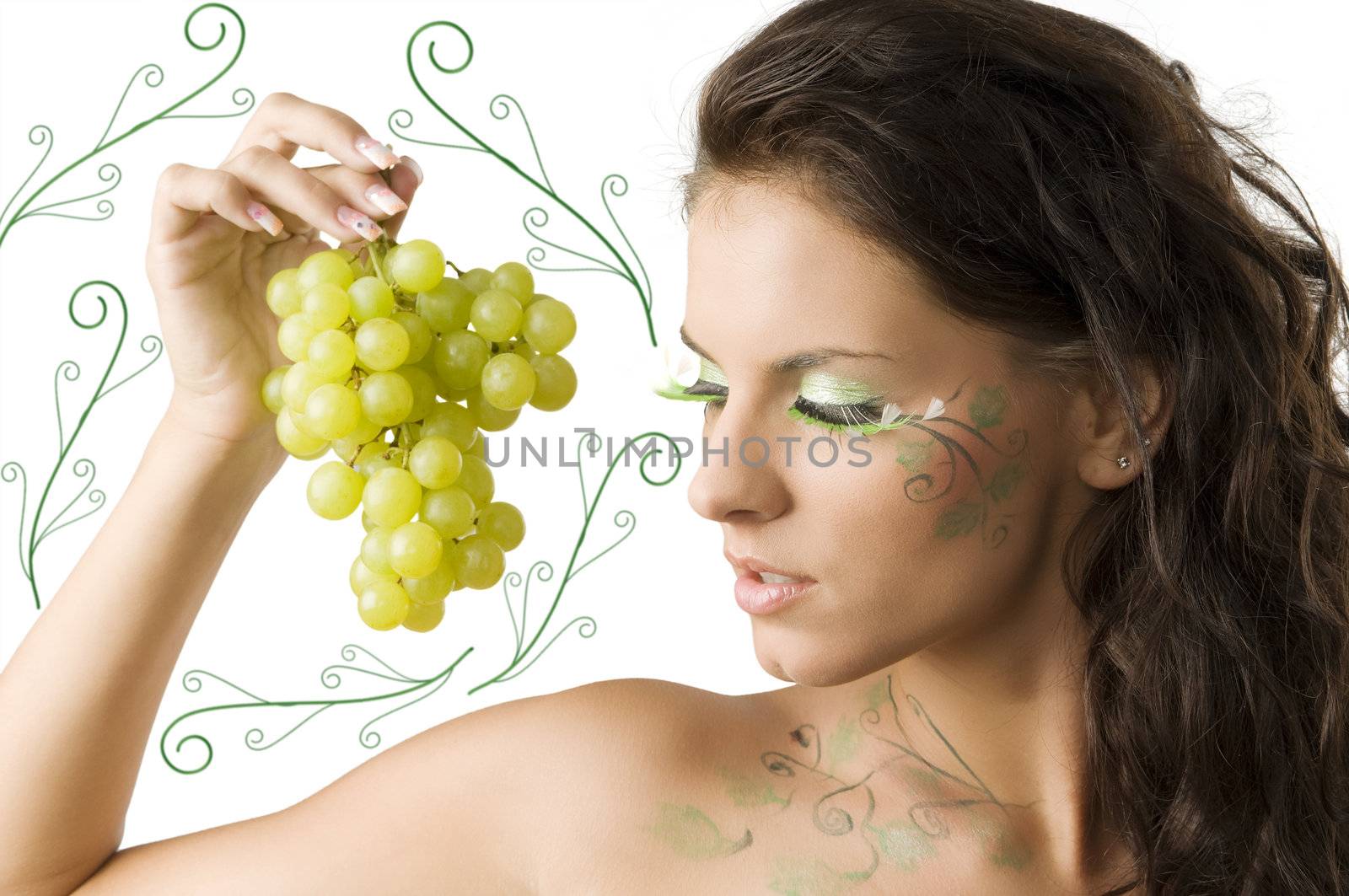 nice brunette with bodypaint and green eyelashes looking a grape