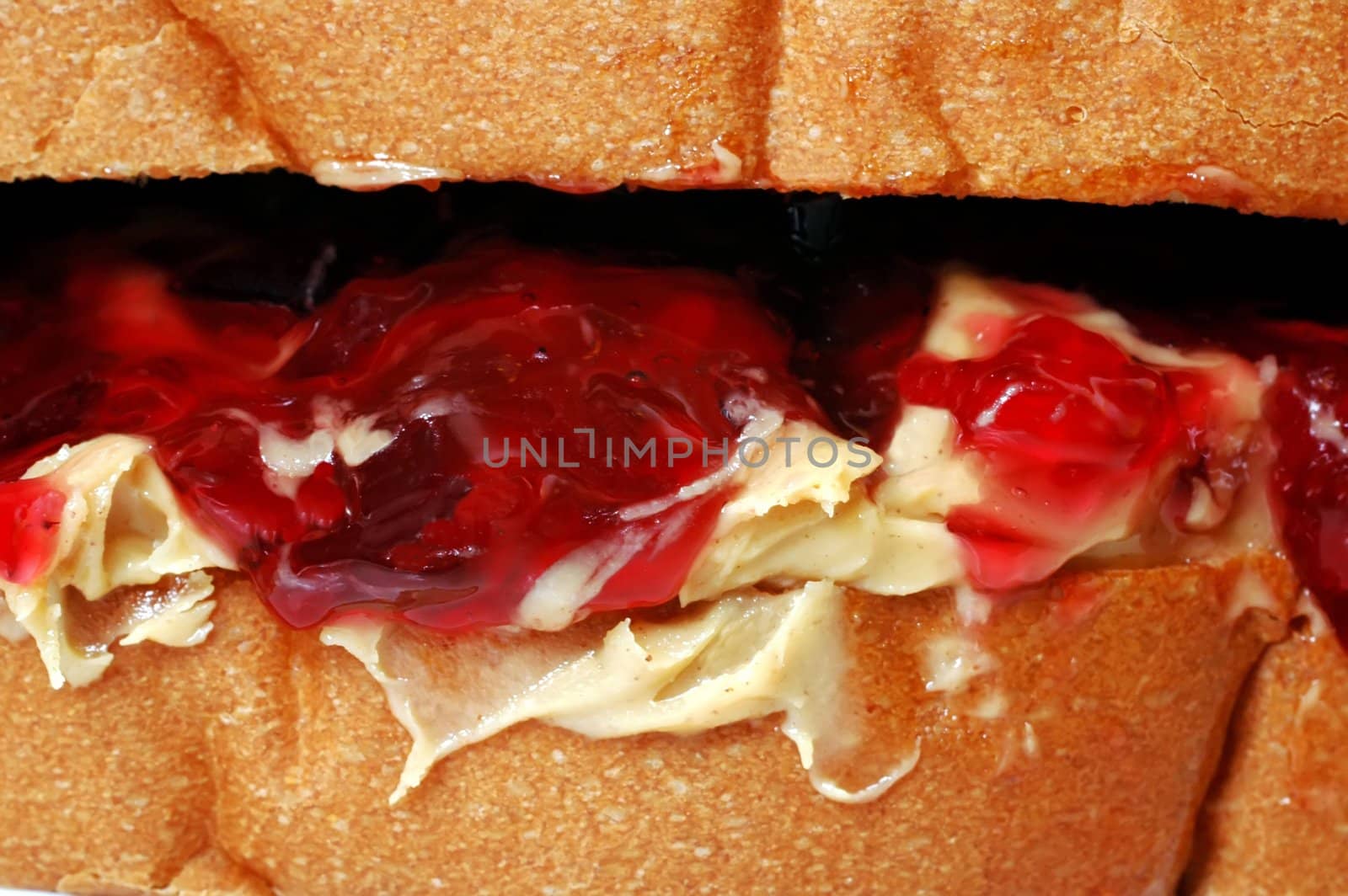 Closeup of peanut butter and jelly sandwich.