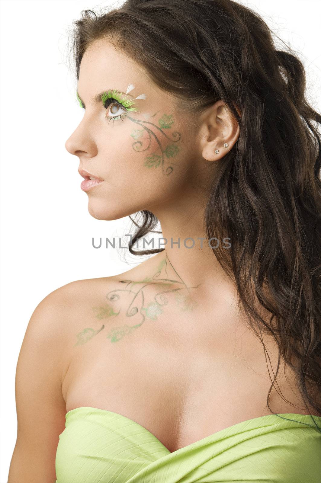 nice portrait of a young woman with paint on her body looking on one side
