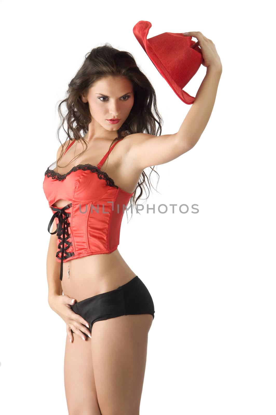 sexy brunette in red lingerie taking off a red hat