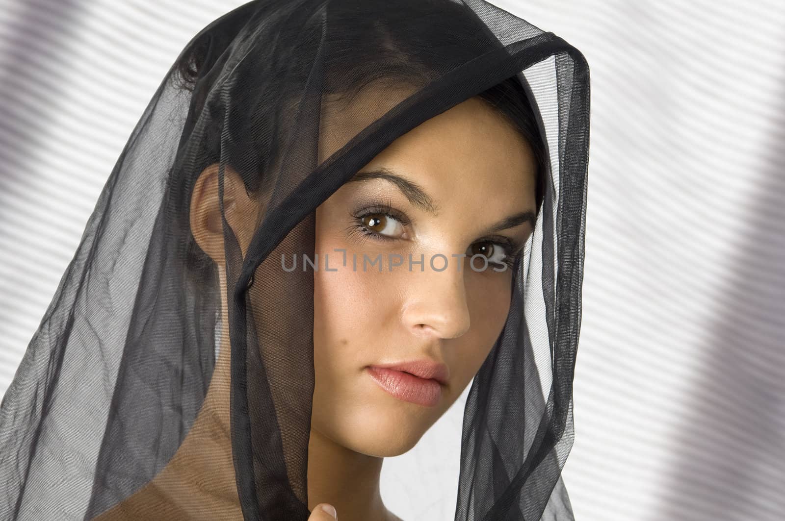nice portrait of a young woman with a black veil on her head