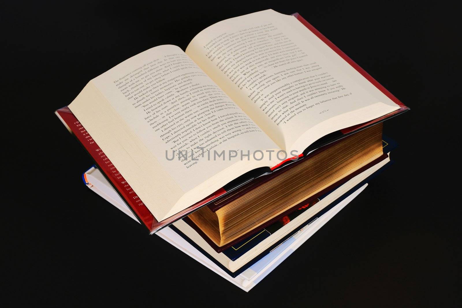 stack of books isolated on black background
