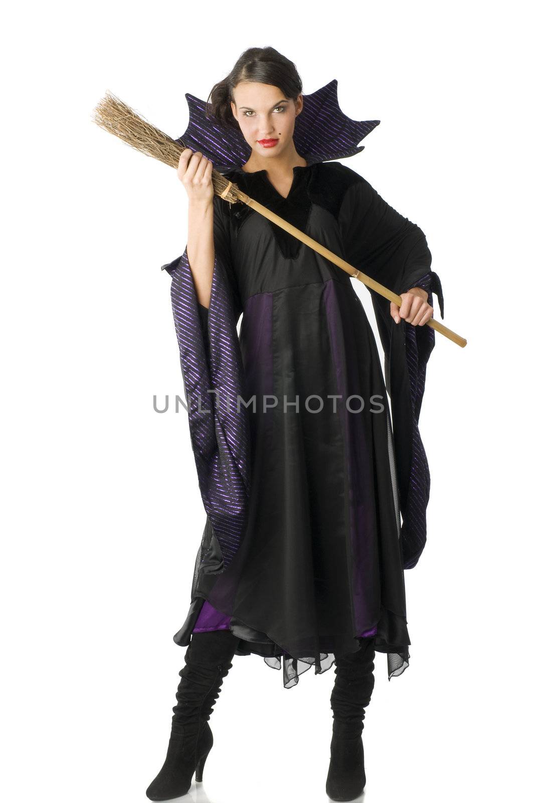 the witch in black dress with a little broom starting to fight