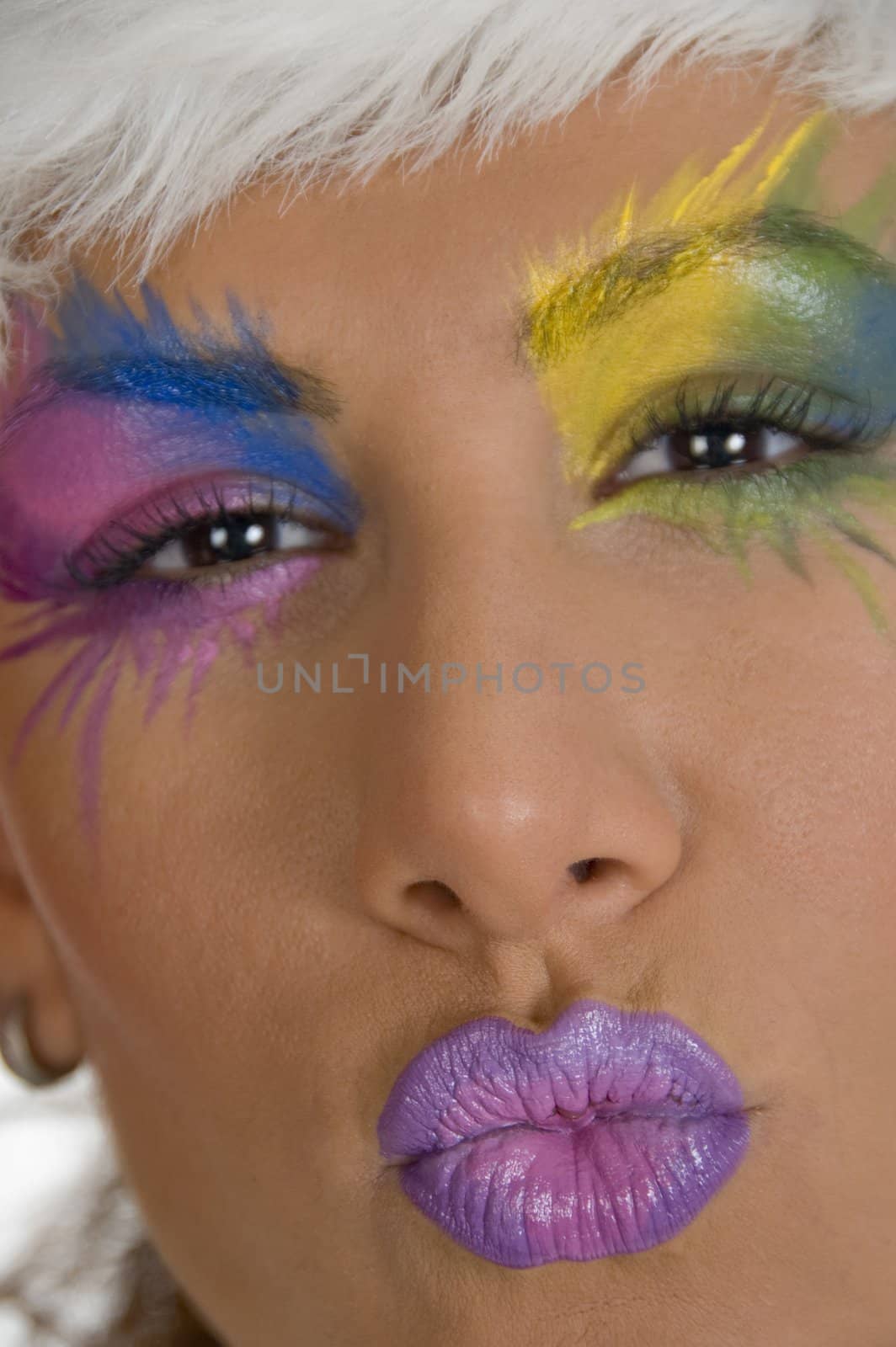 female with kissing expression with makeup on face