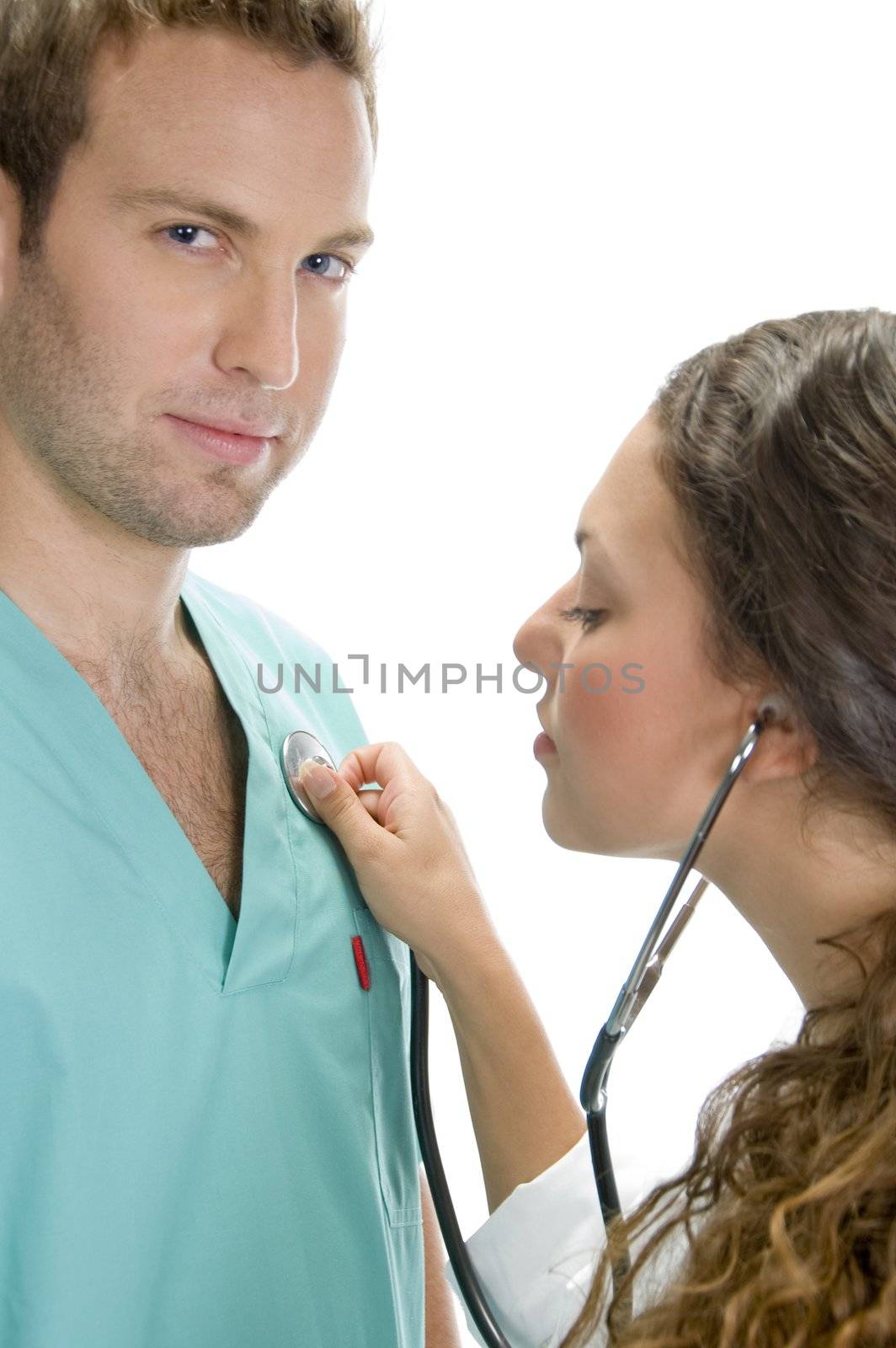 doctor examining the patient with stethoscope by imagerymajestic