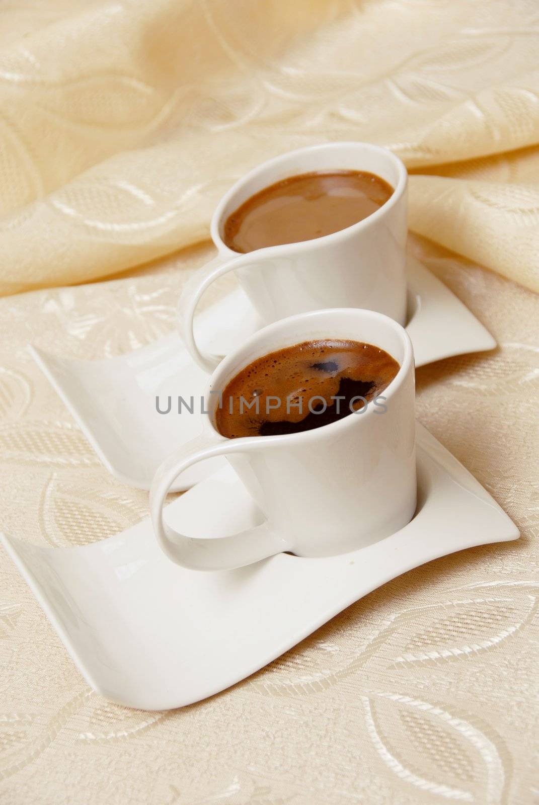 two turkish coffee in white cups on table