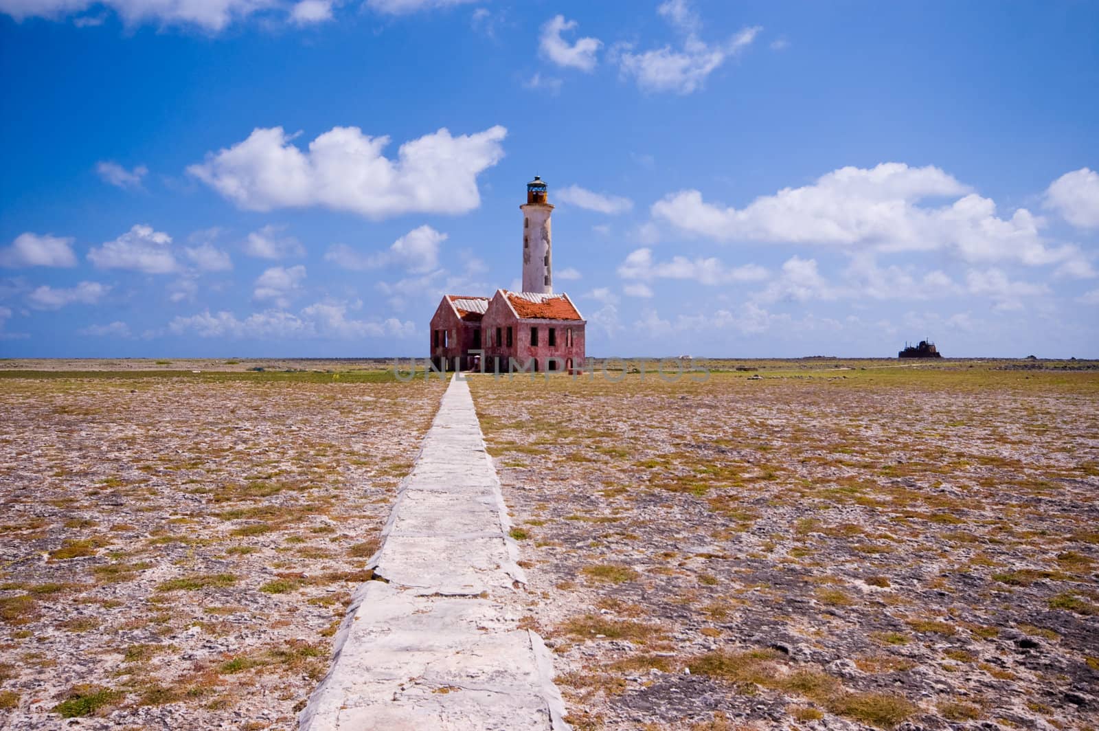 ancient lighthouse ruin on little curacao with foot path